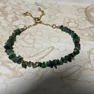 Raw Emerald Stone with Gold Accents